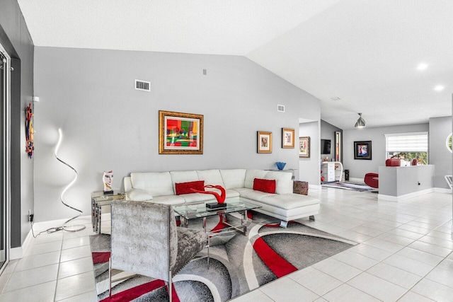 7685 Springwater Pl Unit 201, Boynton Beach, FL 33437 - living area featuring light tile patterned floors, vaulted ceiling, and baseboards