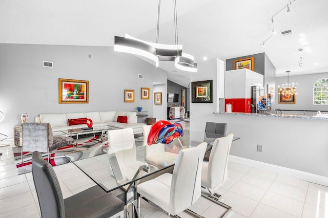 7685 Springwater Pl Unit 201, Boynton Beach, FL 33437 - dining area with a chandelier, track lighting, and light tile patterned floors