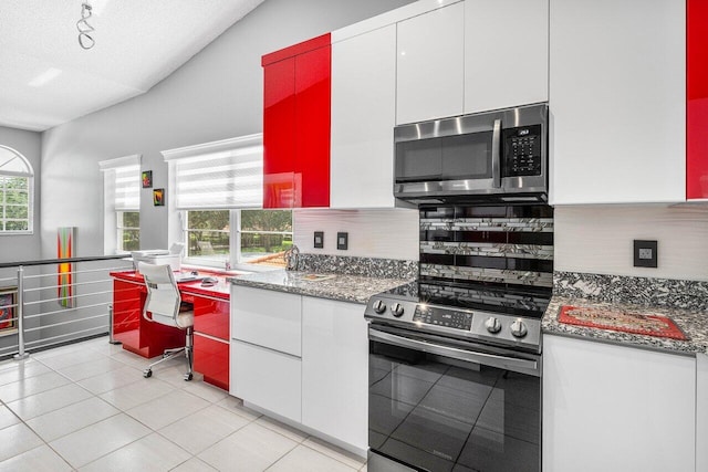 7685 Springwater Pl Unit 201, Boynton Beach, FL 33437 - kitchen with stainless steel appliances, white cabinets, decorative backsplash, a textured ceiling, and stone countertops