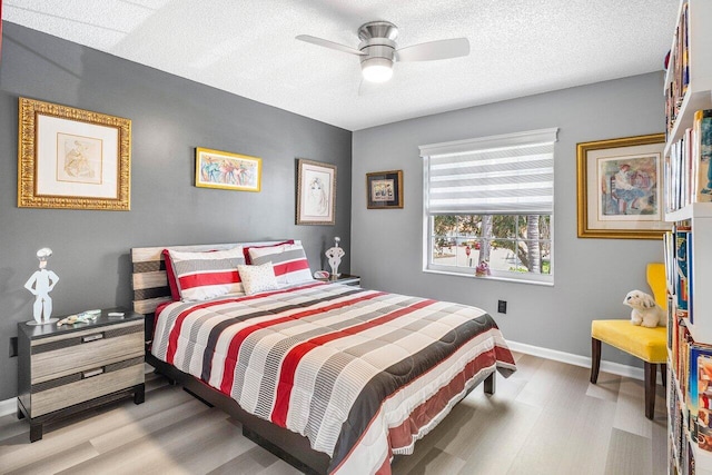 7685 Springwater Pl Unit 201, Boynton Beach, FL 33437 - bedroom featuring wood finished floors, baseboards, ceiling fan, and a textured ceiling
