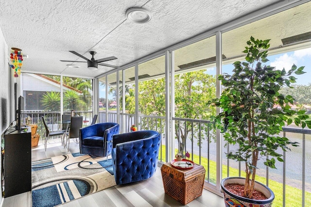 7685 Springwater Pl Unit 201, Boynton Beach, FL 33437 - sunroom with a ceiling fan, a water view, and healthy amount of natural light