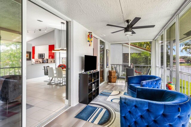 7685 Springwater Pl Unit 201, Boynton Beach, FL 33437 - sunroom with ceiling fan and vaulted ceiling