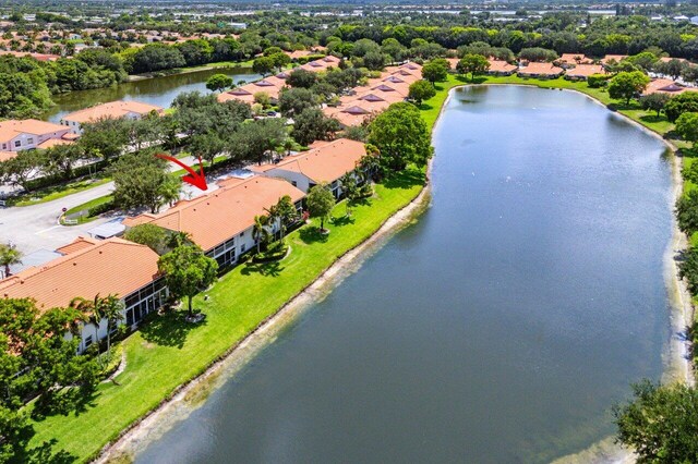 7685 Springwater Pl Unit 201, Boynton Beach, FL 33437 - aerial perspective of suburban area featuring a nearby body of water and a tree filled landscape