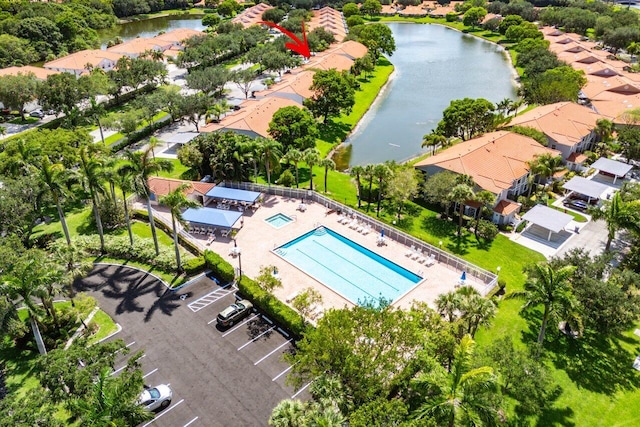 7685 Springwater Pl Unit 201, Boynton Beach, FL 33437 - drone / aerial view of a pool area and a nearby body of water