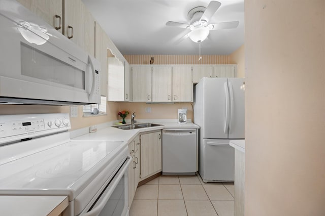 1953 SW Palm City Rd Unit 27-I, Stuart, FL 34994 - kitchen with white appliances, a sink, a ceiling fan, light countertops, and light tile patterned floors