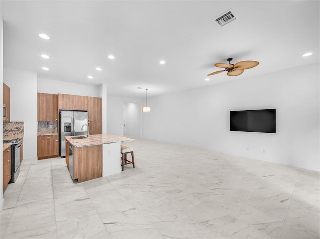 4829 Pointe Midtown Rd Unit 4829, Palm Beach Gardens, FL 33418 - kitchen featuring stainless steel refrigerator with ice dispenser, brown cabinetry, recessed lighting, range, and open floor plan