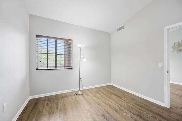 3710 N Jog Rd Unit 202, West Palm Beach, FL 33411 - spare room featuring wood finished floors and baseboards
