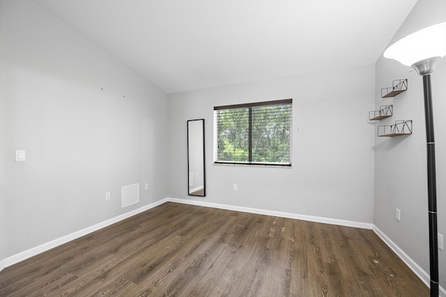 3710 N Jog Rd Unit 202, West Palm Beach, FL 33411 - spare room with vaulted ceiling, wood finished floors, and baseboards
