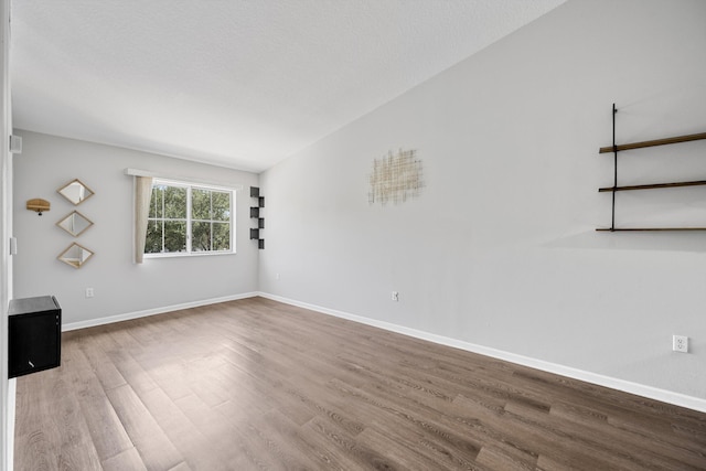 3710 N Jog Rd Unit 202, West Palm Beach, FL 33411 - unfurnished living room featuring wood finished floors and baseboards