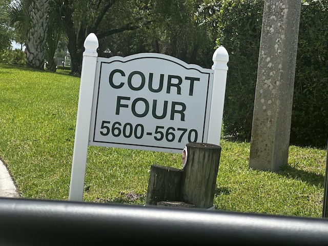 5648 SE Windsong Ln Unit 4-411, Stuart, FL 34997 - community sign featuring a yard
