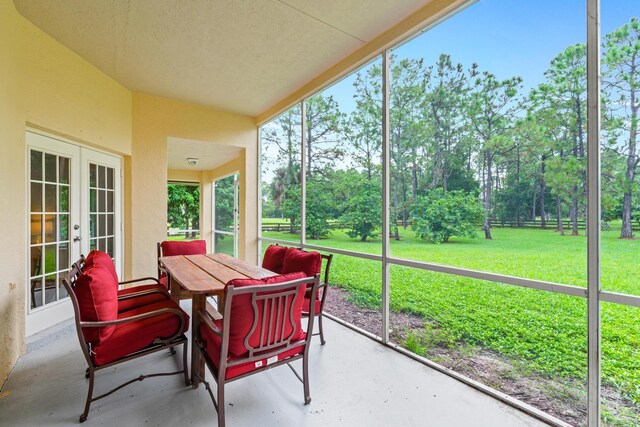 11356 Ira Ln, Lake Worth, FL 33449 - sunroom / solarium featuring french doors and view of wooded area