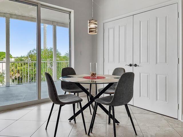 3960 N Flagler Dr Unit 305, West Palm Beach, FL 33407 - dining space featuring light tile patterned floors