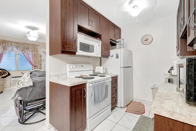 15610 NE 6th Ave NE Unit 10C, Miami, FL 33162 - kitchen featuring white appliances, light countertops, dark brown cabinets, light tile patterned floors, and cooling unit