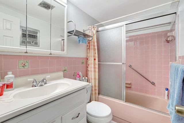 15610 NE 6th Ave NE Unit 10C, Miami, FL 33162 - full bath featuring vanity, enclosed tub / shower combo, toilet, and tile walls