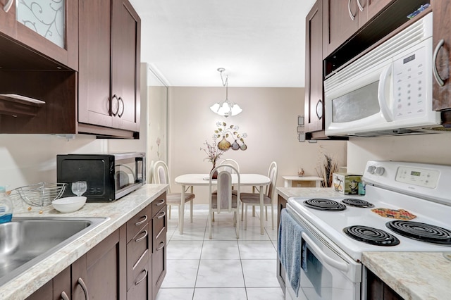 15610 NE 6th Ave NE Unit 10C, Miami, FL 33162 - kitchen with white appliances, light countertops, a sink, and light tile patterned flooring