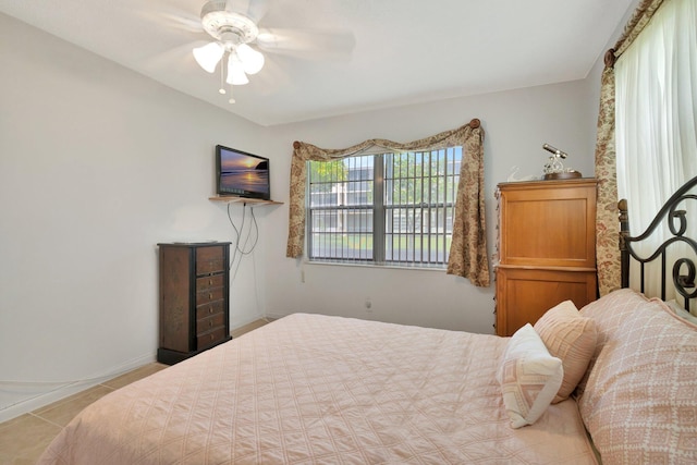 263 Preston Unit G, Boca Raton, FL 33434 - bedroom with tile patterned floors, baseboards, and ceiling fan