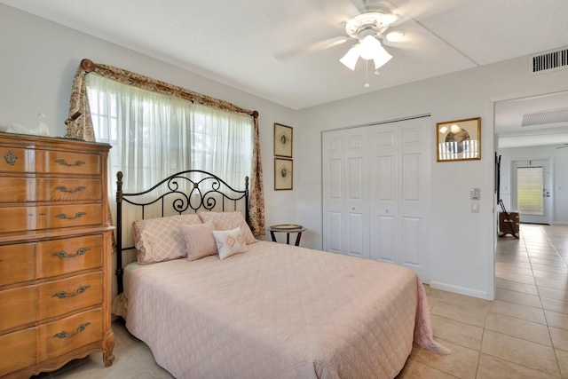 263 Preston Unit G, Boca Raton, FL 33434 - bedroom featuring light tile patterned floors, a closet, ceiling fan, and baseboards