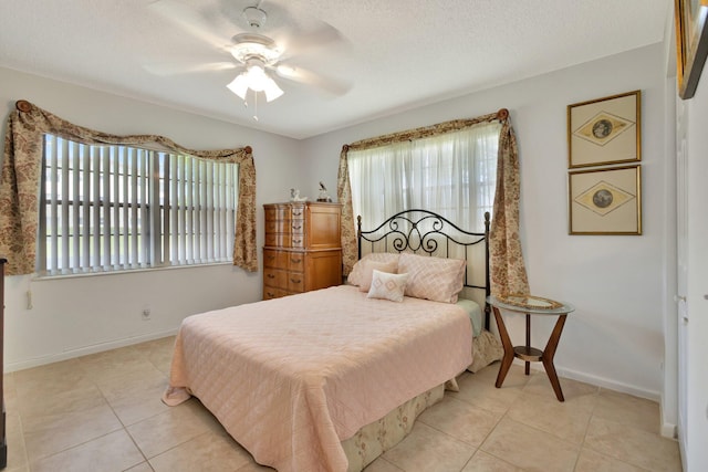 263 Preston Unit G, Boca Raton, FL 33434 - bedroom featuring light tile patterned flooring, baseboards, and a ceiling fan