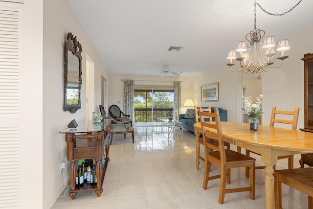 13623 Via Aurora Unit C, Delray Beach, FL 33484 - dining room featuring light tile patterned floors, a ceiling fan, and a chandelier