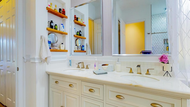 7144 Maidstone Dr, Port Saint Lucie, FL 34986 - full bath with double vanity, built in shelves, and backsplash