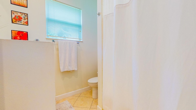 7144 Maidstone Dr, Port Saint Lucie, FL 34986 - bathroom featuring tile patterned flooring, toilet, curtained shower, and baseboards