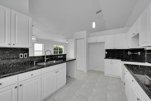 5365 NW 49th St, Coconut Creek, FL 33073 - kitchen with a sink, tasteful backsplash, and dark stone counters