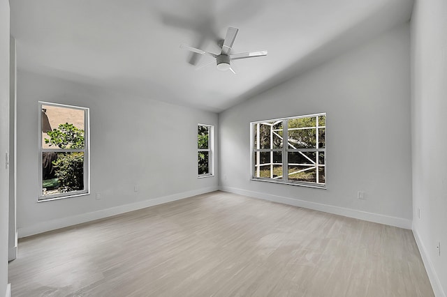 5365 NW 49th St, Coconut Creek, FL 33073 - spare room with vaulted ceiling, a ceiling fan, light wood-style flooring, and baseboards