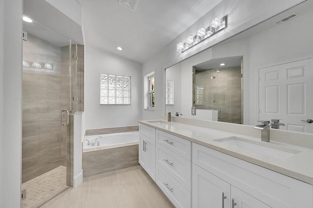 5365 NW 49th St, Coconut Creek, FL 33073 - full bathroom featuring a shower stall, a bath, double vanity, recessed lighting, and vaulted ceiling