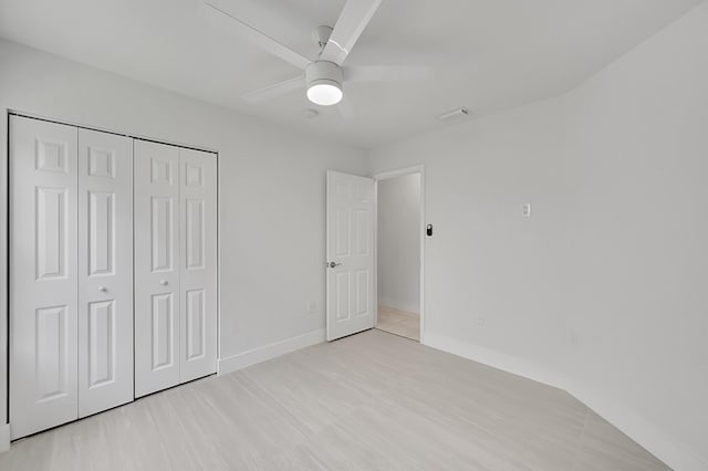 5365 NW 49th St, Coconut Creek, FL 33073 - unfurnished bedroom featuring a closet, a ceiling fan, and baseboards