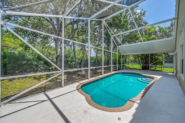 5365 NW 49th St, Coconut Creek, FL 33073 - swimming pool featuring a patio area, glass enclosure, and view of scattered trees