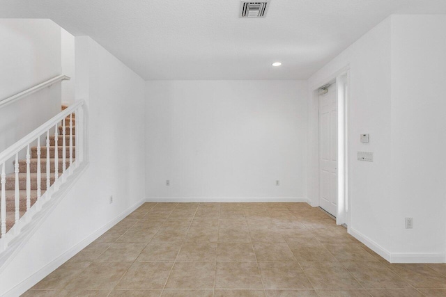 1463 N Jeaga Dr, Jupiter, FL 33458 - tiled empty room with stairway, recessed lighting, and baseboards