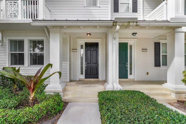 1463 N Jeaga Dr, Jupiter, FL 33458 - doorway to property featuring covered porch