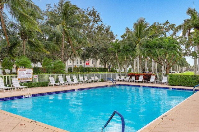 1463 N Jeaga Dr, Jupiter, FL 33458 - community pool with a patio area