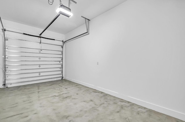 1233 NE 12th Ave Unit A, Fort Lauderdale, FL 33304 - garage featuring a garage door opener and baseboards