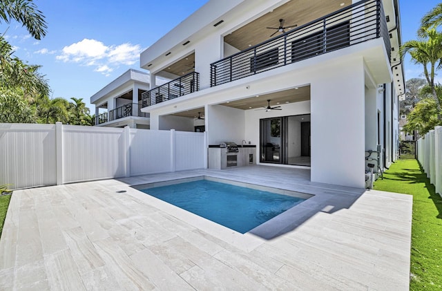 1233 NE 12th Ave Unit A, Fort Lauderdale, FL 33304 - view of pool with ceiling fan, a fenced backyard, an outdoor kitchen, and a patio area