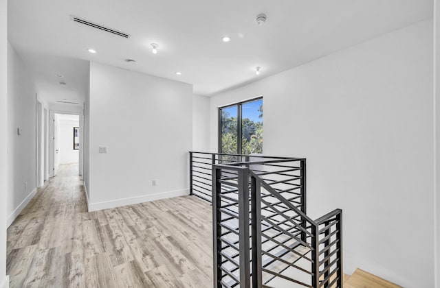 1233 NE 12th Ave Unit A, Fort Lauderdale, FL 33304 - unfurnished room featuring light wood-type flooring, a smoke detector, recessed lighting, and baseboards
