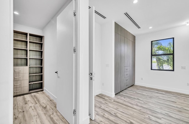 1233 NE 12th Ave Unit A, Fort Lauderdale, FL 33304 - hallway featuring light wood-style flooring, recessed lighting, and baseboards