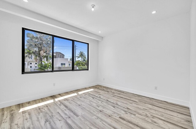 1233 NE 12th Ave Unit A, Fort Lauderdale, FL 33304 - spare room with wood finished floors, baseboards, and recessed lighting