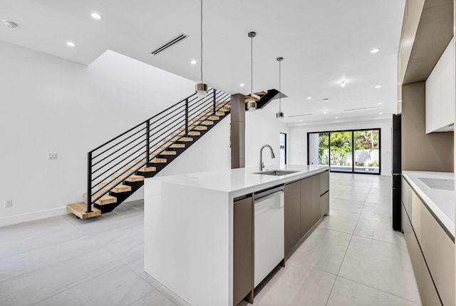 1233 NE 12th Ave Unit A, Fort Lauderdale, FL 33304 - kitchen featuring modern cabinets, a sink, light countertops, recessed lighting, and dishwasher
