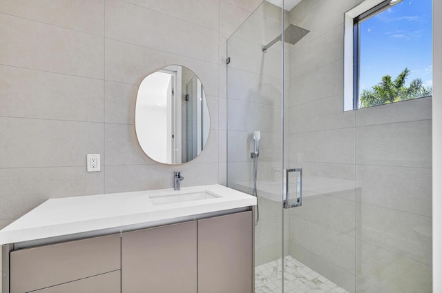 1233 NE 12th Ave Unit A, Fort Lauderdale, FL 33304 - full bath featuring a shower stall, vanity, and tile walls