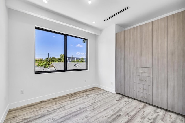1233 NE 12th Ave Unit A, Fort Lauderdale, FL 33304 - unfurnished bedroom featuring light wood-type flooring, recessed lighting, and baseboards