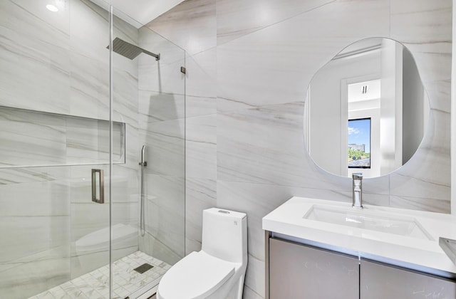 1233 NE 12th Ave Unit A, Fort Lauderdale, FL 33304 - bathroom with vanity, toilet, a shower stall, and tile walls