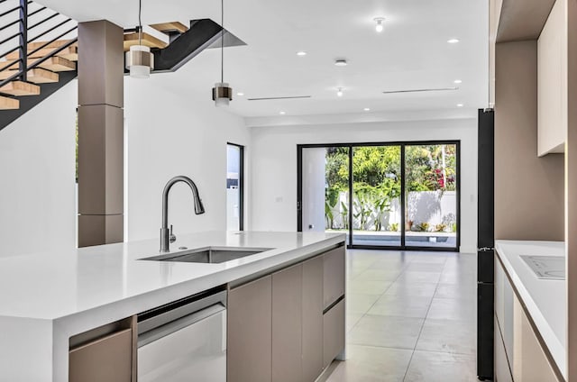 1233 NE 12th Ave Unit A, Fort Lauderdale, FL 33304 - kitchen with modern cabinets, a sink, healthy amount of natural light, light countertops, and recessed lighting