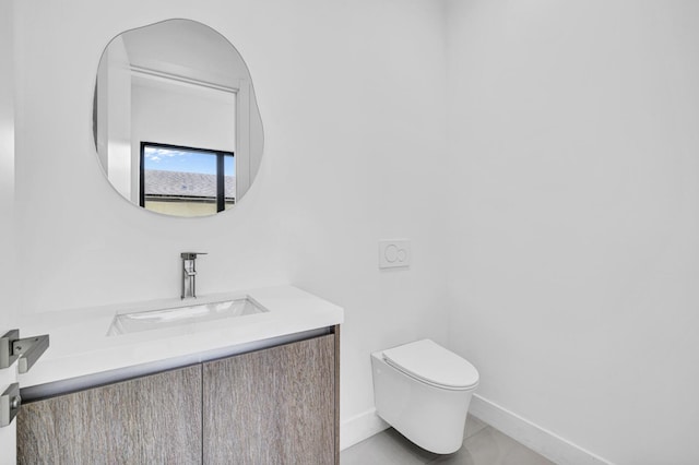 1233 NE 12th Ave Unit A, Fort Lauderdale, FL 33304 - bathroom with toilet, vanity, and baseboards