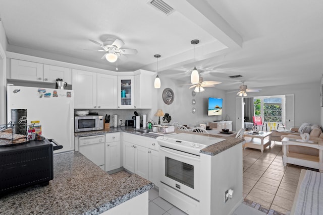 2121 NE 1st Ct Unit 202, Boynton Beach, FL 33435 - kitchen featuring white appliances, a peninsula, ceiling fan, and open floor plan