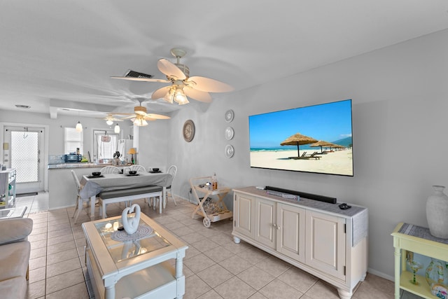2121 NE 1st Ct Unit 202, Boynton Beach, FL 33435 - living room with ceiling fan, light tile patterned floors, and baseboards
