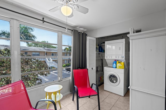 2121 NE 1st Ct Unit 202, Boynton Beach, FL 33435 - washroom featuring stacked washer / drying machine, tile patterned floors, and ceiling fan