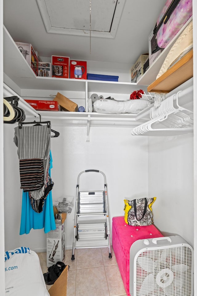 2121 NE 1st Ct Unit 202, Boynton Beach, FL 33435 - spacious closet featuring attic access and light tile patterned floors