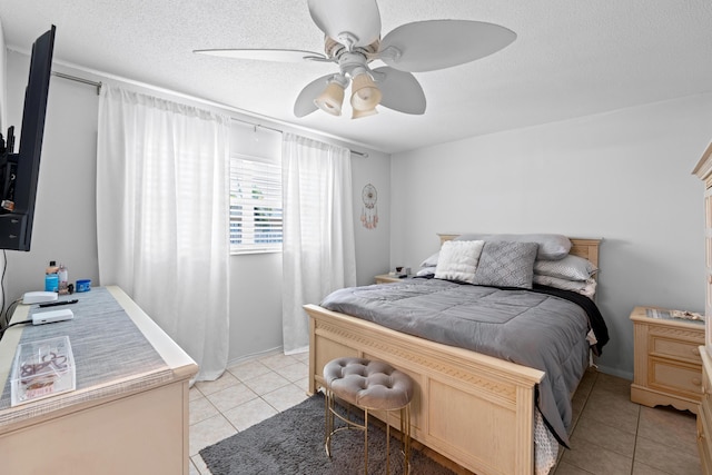 2121 NE 1st Ct Unit 202, Boynton Beach, FL 33435 - bedroom with light tile patterned flooring, ceiling fan, and a textured ceiling