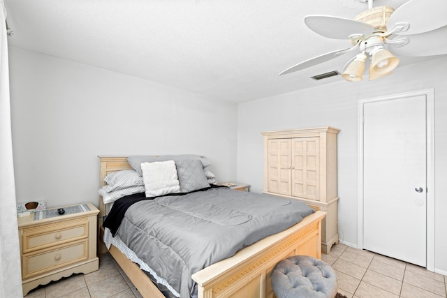 2121 NE 1st Ct Unit 202, Boynton Beach, FL 33435 - bedroom with light tile patterned floors and a ceiling fan